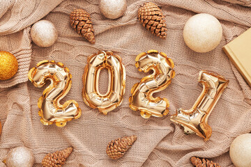 Figure 2020 made of balloons and Christmas decor on fabric background