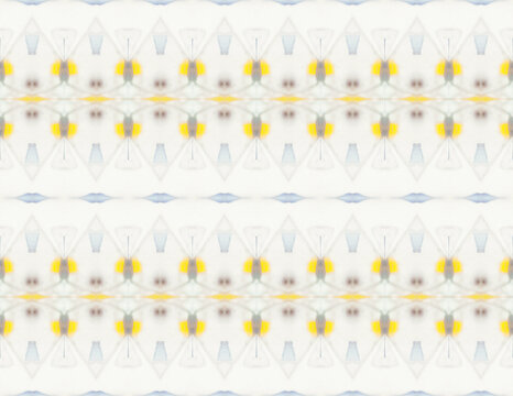 Delicate yellow pattern created by pebbles inside kaleidoscope