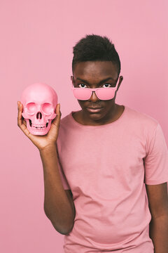 Young black man with a pink skull