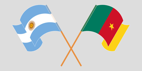Crossed and waving flags of Cameroon and Argentina