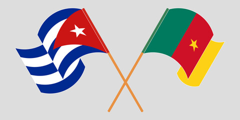 Crossed and waving flags of Cameroon and Cuba