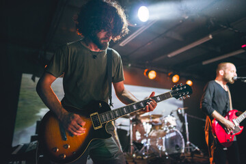 Rock and roll band performing in live concert