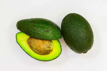 Open avocado on a white background. Avocado macro. Close up of an avacado. Avocado isolated on white background.