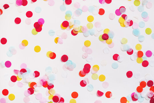 Colorful paper confetti on white background