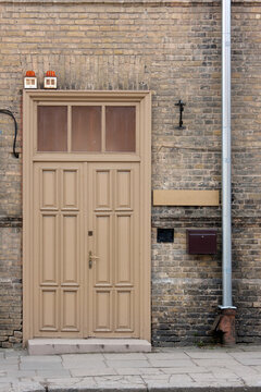 Beige door in a brick building