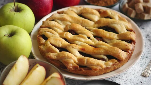 Traditional baked apple pie cake served on ceramic plate