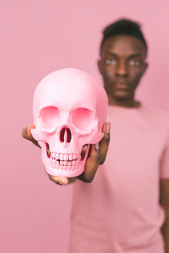 Young black man with a pink skull
