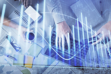 Double exposure of man and woman working together and forex graph hologram drawing. Financial analysis concept. Computer background. Top View.