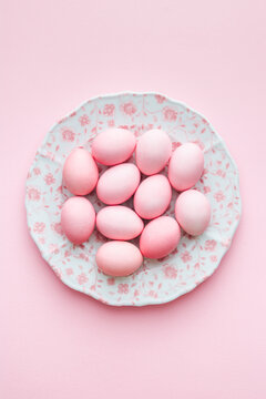 Pink Easter eggs on pink background
