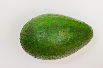 Avocado on a white background. Avocado macro. Close up of an avacado. Avocado isolated on white background.