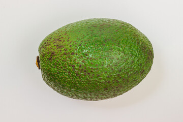 Avocado on a white background. Avocado macro. Close up of an avacado. Avocado isolated on white background.