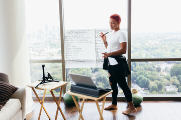Black woman having virtual brainstorm meeting at home during pandemic