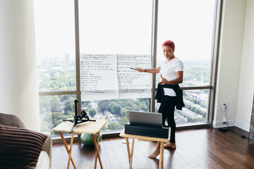 Black woman having virtual brainstorm meeting at home during pandemic