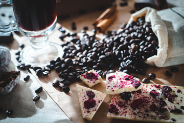 coffee composition with a glass of coffee and sweets on a rustic background close up