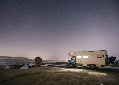 camping truck standing in cappadocia at night, turkey