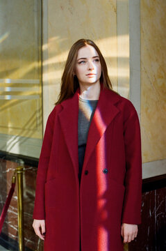 Young woman wearing red coat