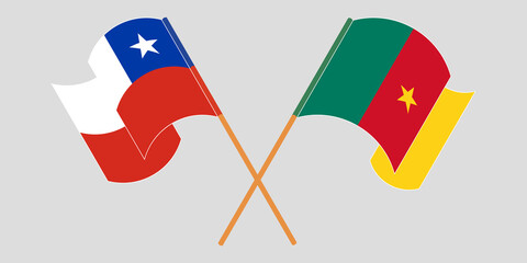 Crossed and waving flags of Cameroon and Chile