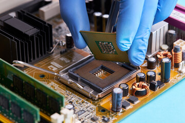 computer hardware service concept. technician repairing desktop pc or laptop circuit board. person...