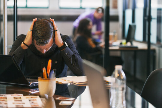Office: Frustrated Businessman With Hands On Head