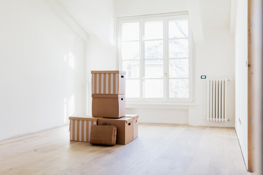 Moving into a new home: boxes inside empty room