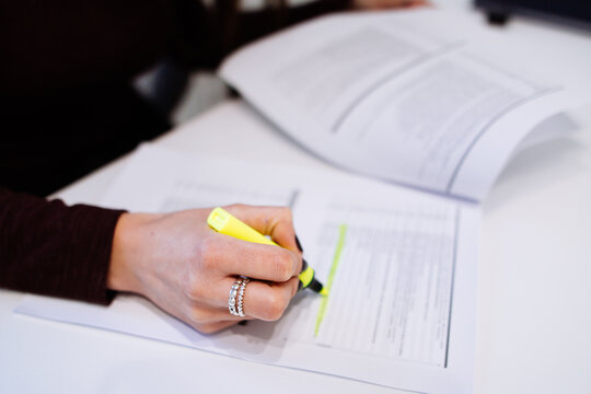 Woman hands with sheets of paper