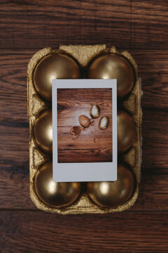 Polaroid Picture on a Golden Easter Eggs