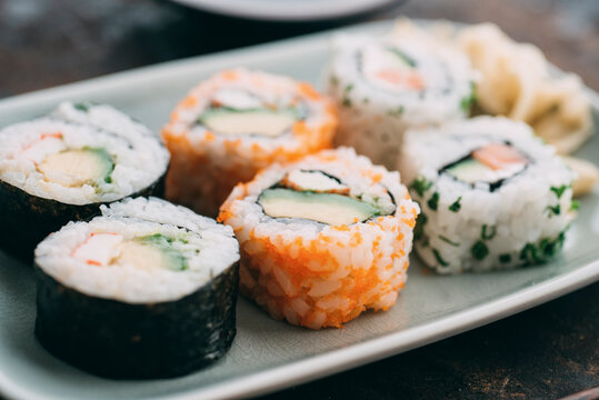 Food: Sushi rolls on a plate with ginger