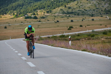 Fototapeta premium triathlon athlete riding bike
