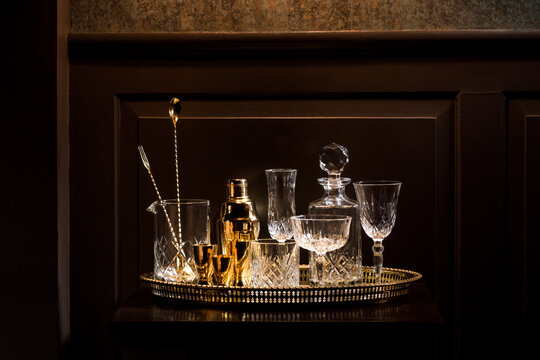Vintage glassware and bar gear on a bar table