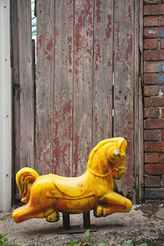 Retro vintage old children's toy in laneway