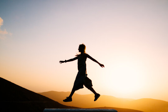 Silhouette of woman in a mountain landscape