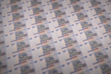 50 russian rubles bills printed in illegal money production conveyor. Collage of many fake bills....