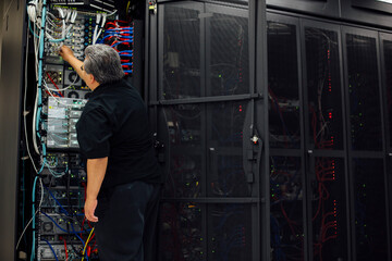 IT computer expert solving problems in server room