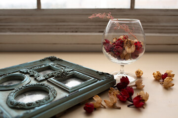 still life. glass and petals