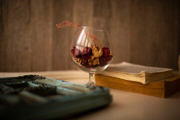 still life. glass and petals