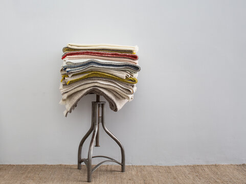 Stool with stack of wool blankets