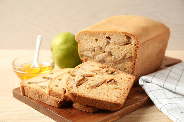 Composition with tasty pear bread on wooden table, closeup. Homemade cake