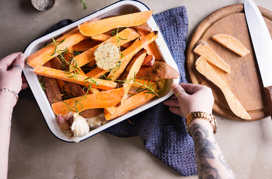 Sweet potato fries being prepared for cooking.