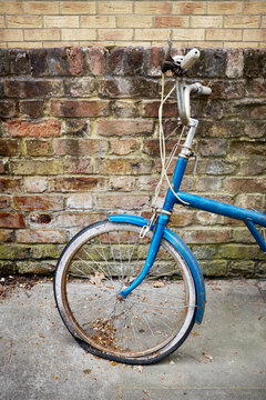 Old bicycle with flat tire