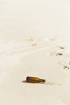 Empty bottle on beach