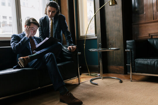 Businessmen Reviewing Business Proposal