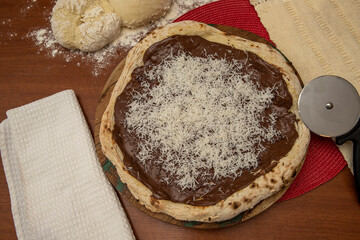 Chocolate pizza and grated coconut