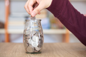 Put the coin in the glass bottle