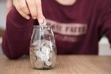 Put a coin in a glass bottle