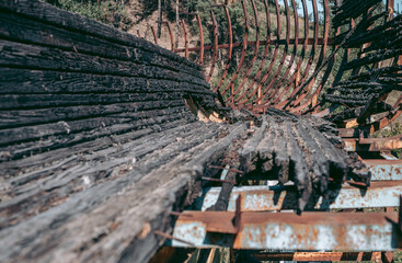 Old abandoned wooden bobsleigh track in summer by daylight