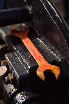 Red screw key in groove