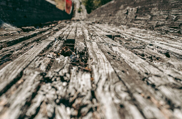 Old abandoned wooden bobsleigh track in summer by daylight