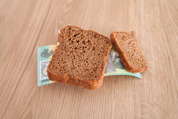 Australian dollar banknotes and slices of bread