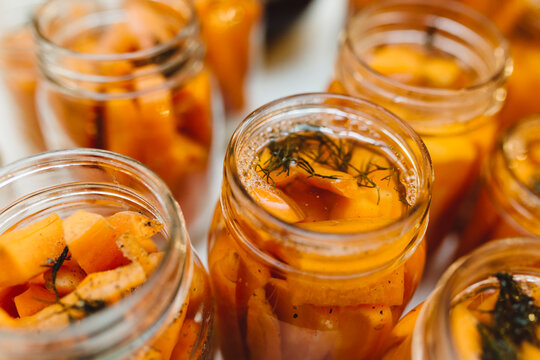 Jars of carrots, dill and vinegar to be preserved