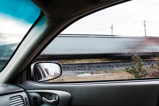 Waiting for a train at a railroad crossing.